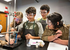 Middle school students in science class